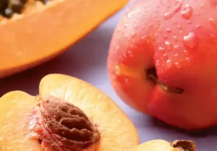 Fresh fruit including papaya and peach, natural food sources associated with L-Arginine